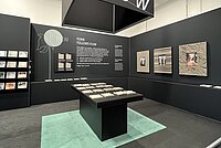 Green and black RECKLI exhibition stand at BAU 2023.